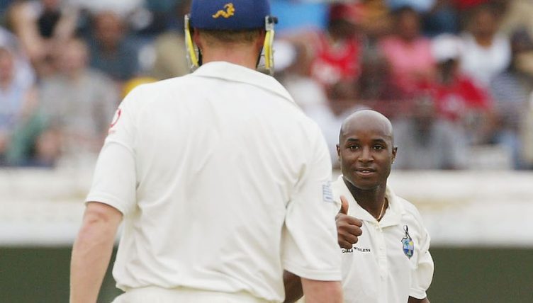 KINGSTON, JAMAICA - MARCH 13: Tino Best of the West Indies gives the thumbs up to Andrew Flintoff of England during Day 3 of the 1st Test between West Indies and England at Sabina Park, on March 13, 2004, in Kingston, Jamaica. (Photo by Tom Shaw/Getty Images) *** Local Caption *** Tino Best;Andrew Flintoff