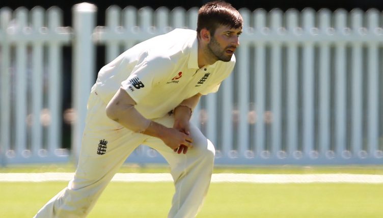 Mark Wood holding himself