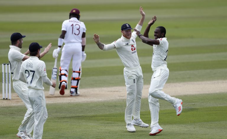 England's Jofra Archer, right, celebrates taking the wicket of West Indies' Shamarh Brooks