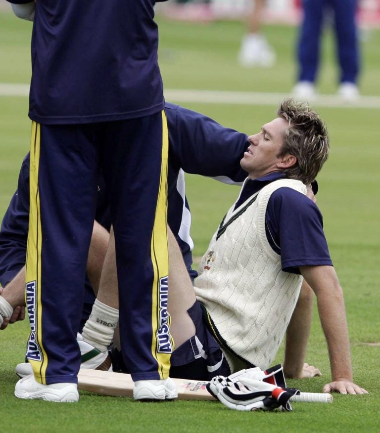 Glenn McGrath receives treatment after injuring himself at Edgbaston