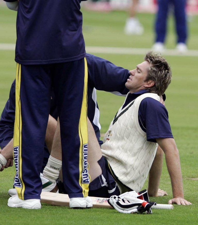 Glenn McGrath receives treatment after injuring himself at Edgbaston