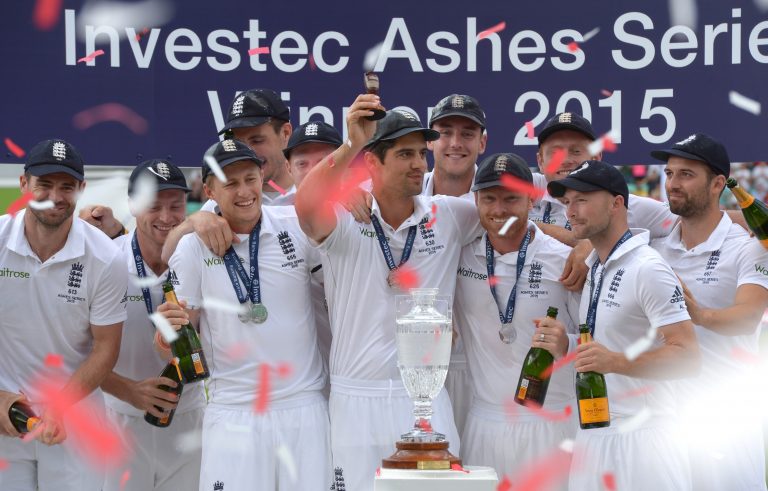 England captain Alastair Cook lifts the Ashes Urn after victory in 2015