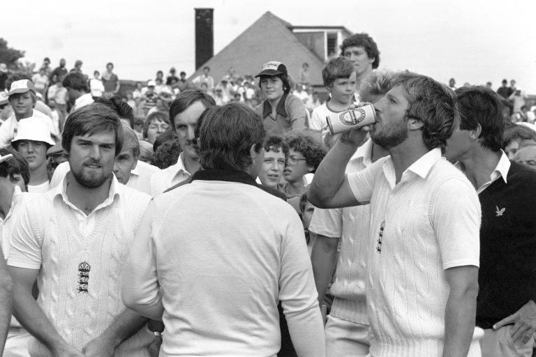 England hero Ian Botham downs a beer given to him by Marsh after the fifth Test