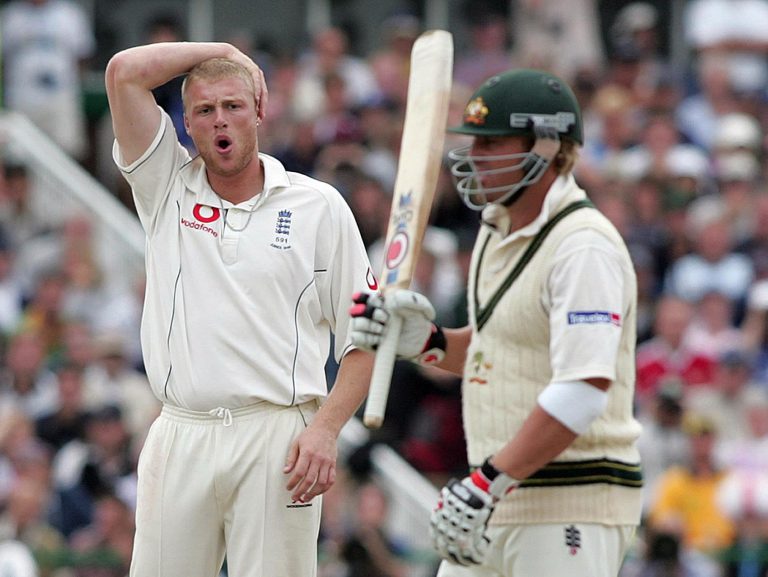 England's Andrew Flintoff looks dejected after another chance to dismiss Shane Warne goes