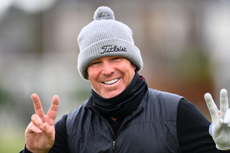 Shane Warne celebrates settling phone hacking claims against the publishers of the News Of The World in December 2021