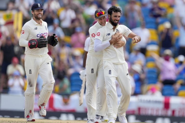 Saqib Mahmood celebrates his first Test wicket