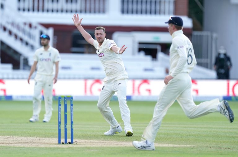 Robinson (centre) made his Test debut against New Zealand last summer.