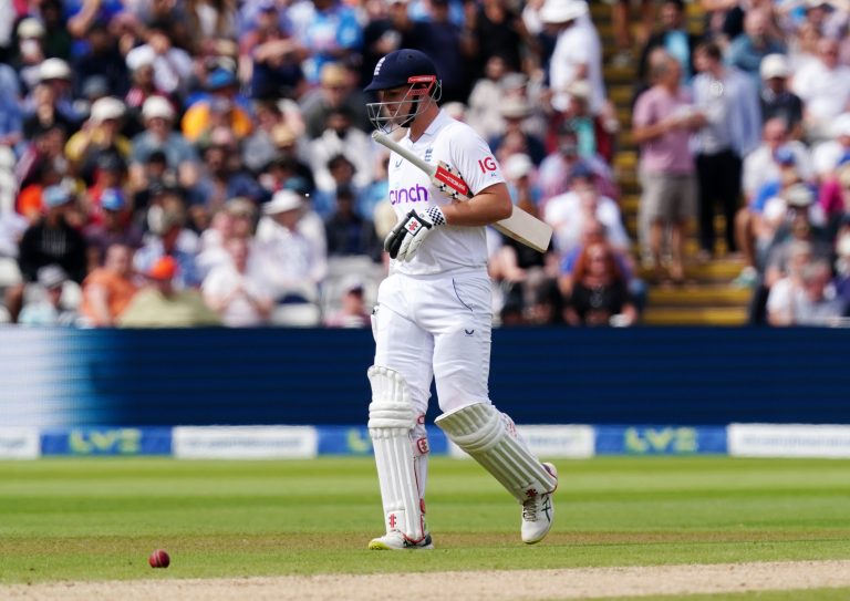 England's Alex Lees walks off after being run out
