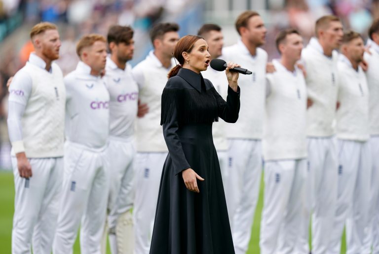 Laura Wright sings the national anthem and is joined by the England team