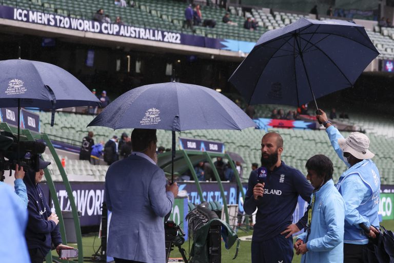 England's Moeen Ali is interviewed under rainy conditions 