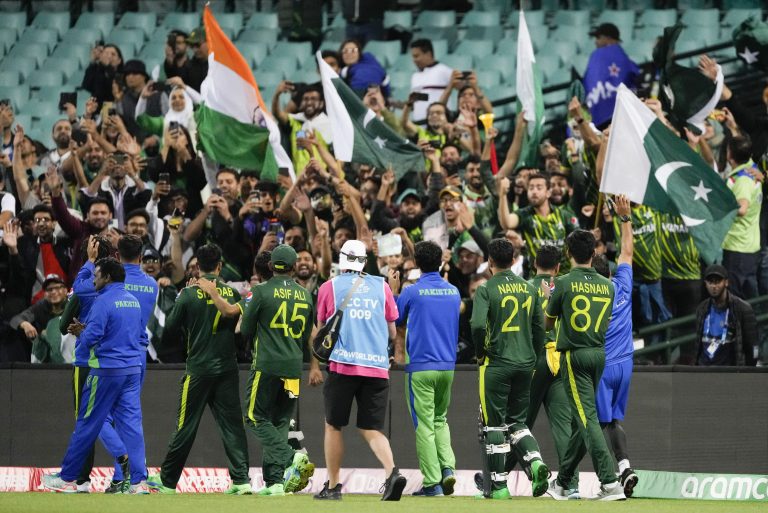 Pakistan players wave to their supporters after reaching the final 