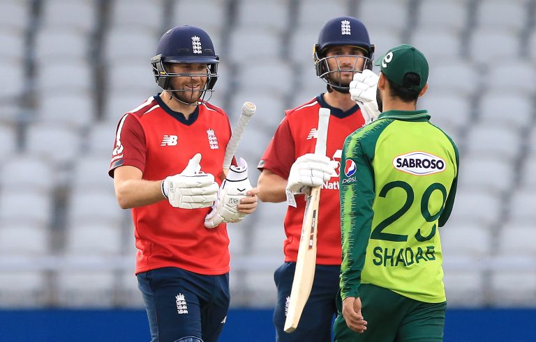 England's Dawid Malan, left, and Lewis Gregory shake hands with Pakistan's Shadab Khan after August 2020's T20 win at Old Trafford