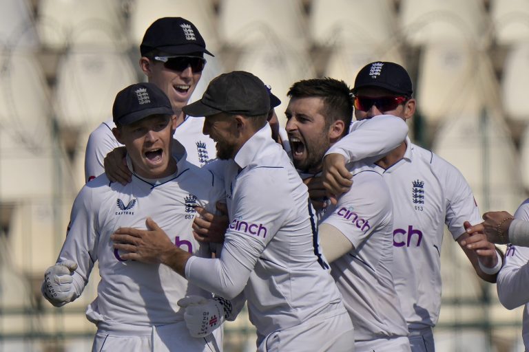 Mark Wood (second right) celebrates with team-mates after the dismissal of Pakistan's Saud Shakeel