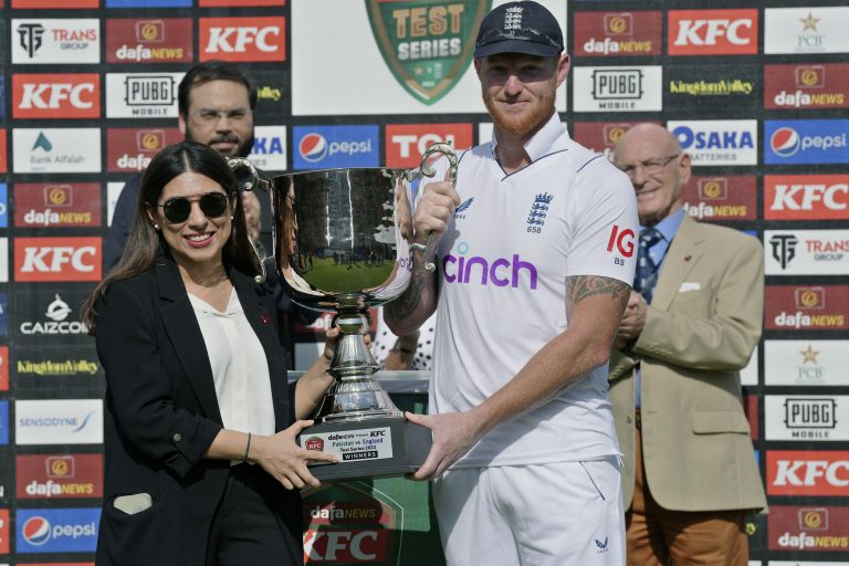 England skipper Ben Stokes receives the trophy 