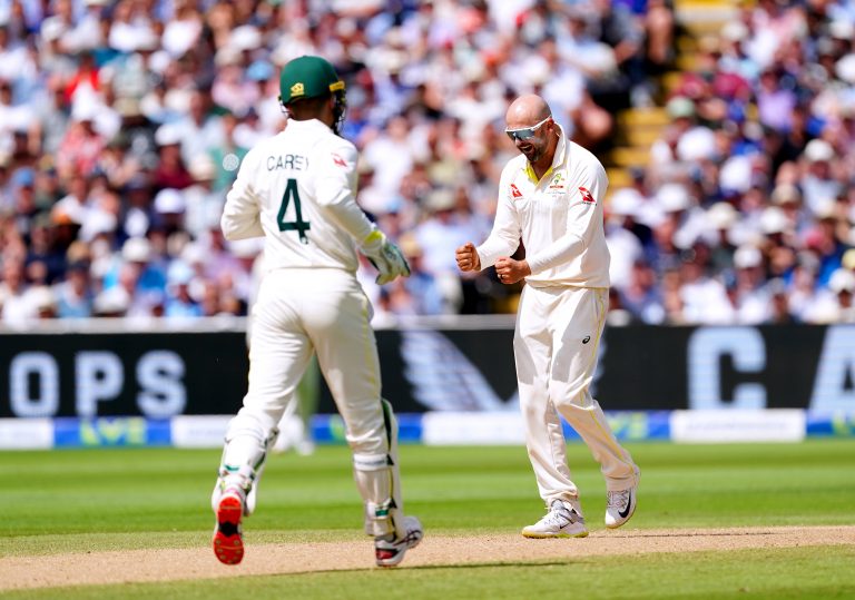 Nathan Lyon (right) celebrates the wicket of Jonny Bairstow