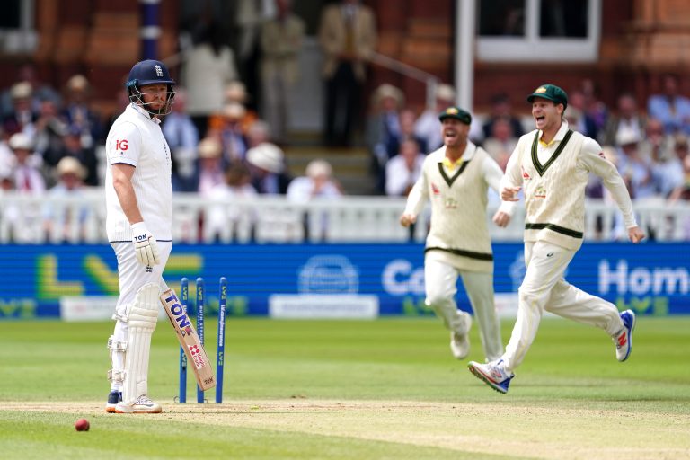 England's Jonny Bairstow, left, looks frustrated after being run out by Australia's Alex Carey