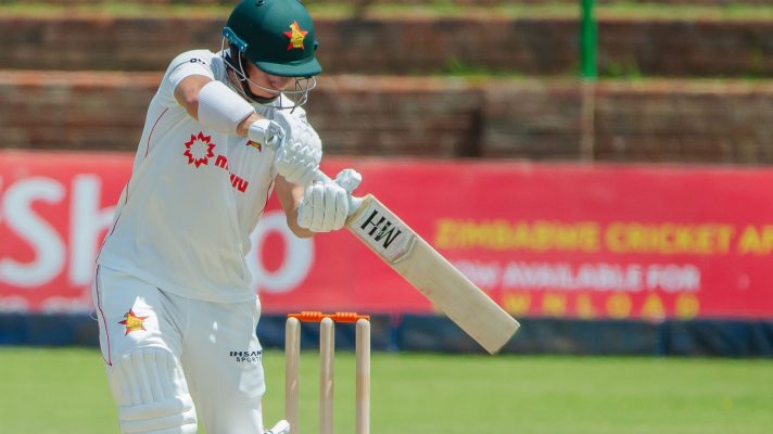 Ben Curran hits a cricket ball.