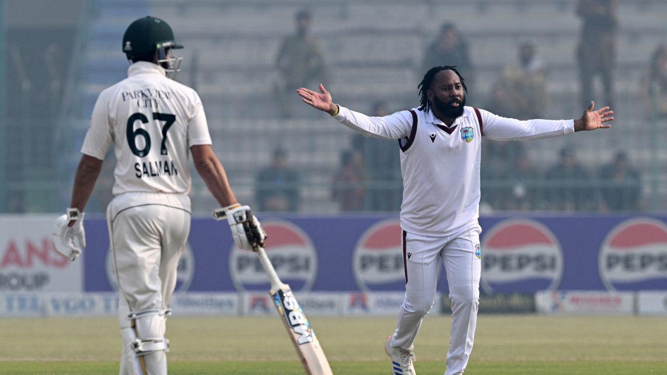 Jomel Warrican celebrates for West Indies