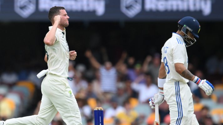 Josh Hazlewood dismisses Virat Kohli.