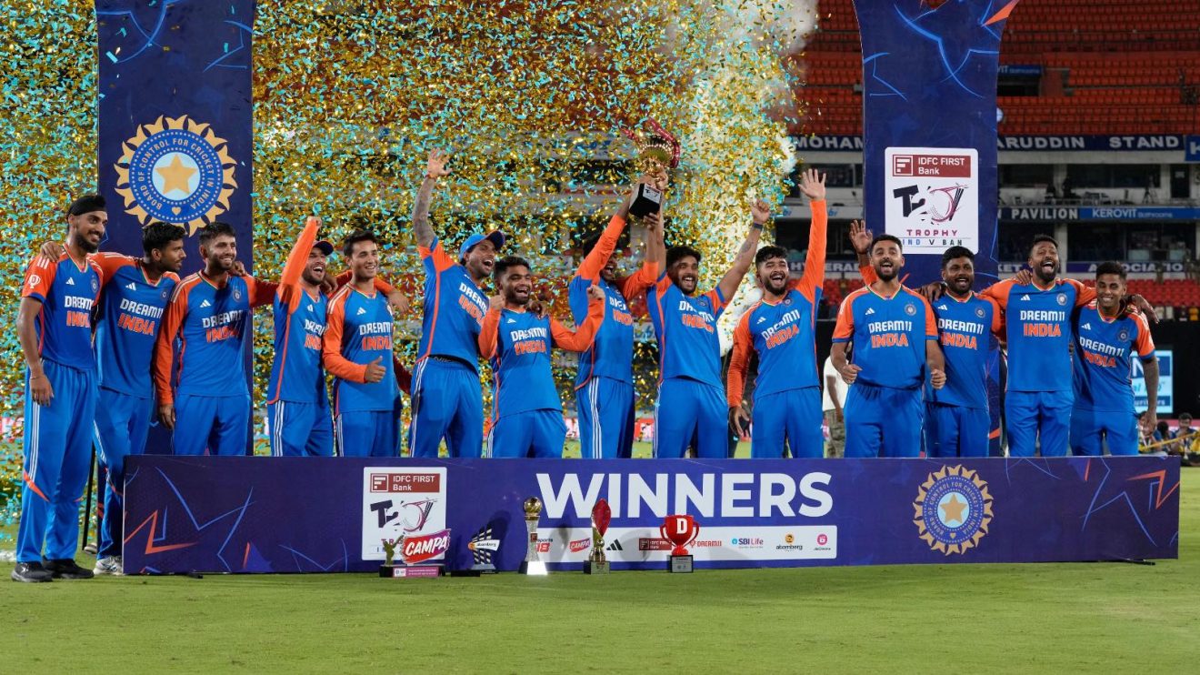 Indian players celebrate with the trophy after winning the T20 cricket series against Bangladesh in Hyderabad