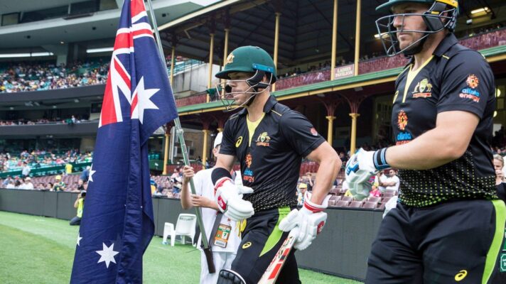 David Warner of Australia and Aaron Finch of Australia walk out on the field during the Twenty20 International cricket match between Australia and Pakistan at The Sydney Cricket Ground