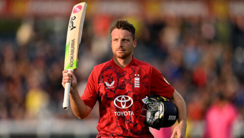 Jos Buttler celebrates and raises his bat