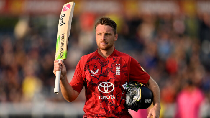 Jos Buttler celebrates and raises his bat