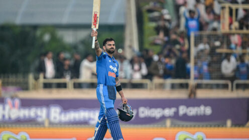 Virat Kohli raises his bat