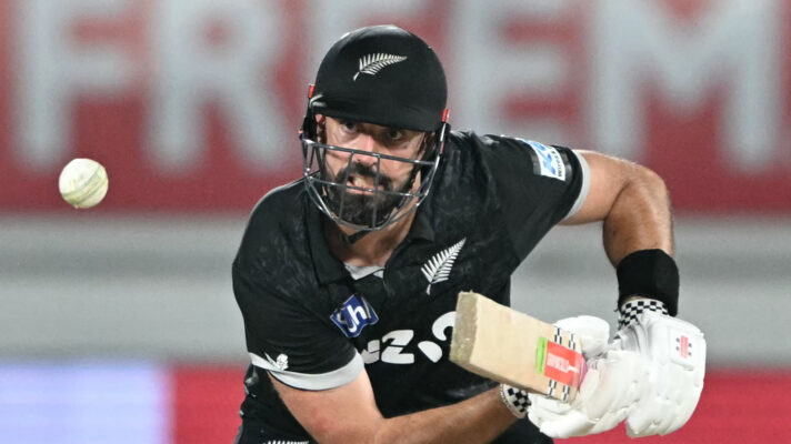 Daryl Mitchell plays cricket